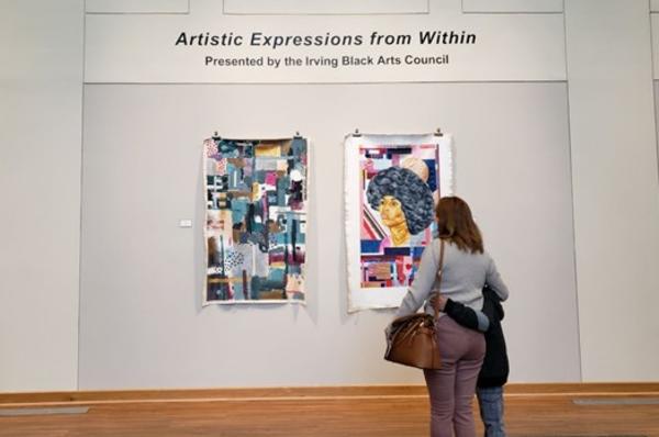 onlookers checking out art at the Irving Arts Center