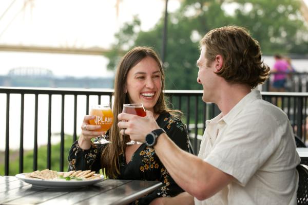 Couple cheers their craft beer at Upland Brewing Co. in Jeffersonville, IN