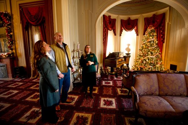 Couple touring the Culbertson Manion during Christmas
