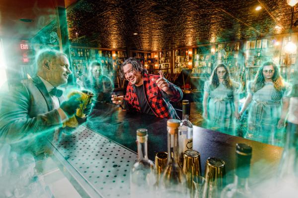 Bartender surrounded by ghosts