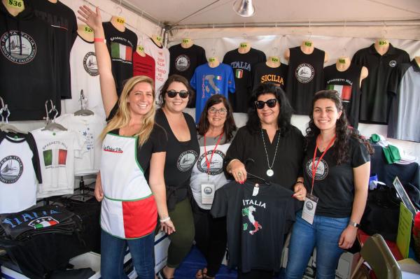 Group Of Women At the Festa Italia merch booth