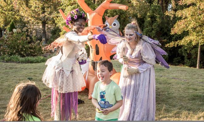 Spooky Springs fairies playing with children at Abernathy Greenway Playable Art Park