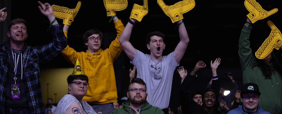 Crowd cheering and waving arms during the HSC Global Invitational