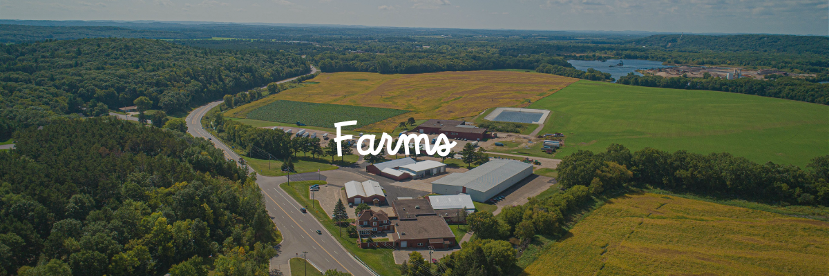 An aerial view of Huntsinger Farms with the word "farms" on top of the image