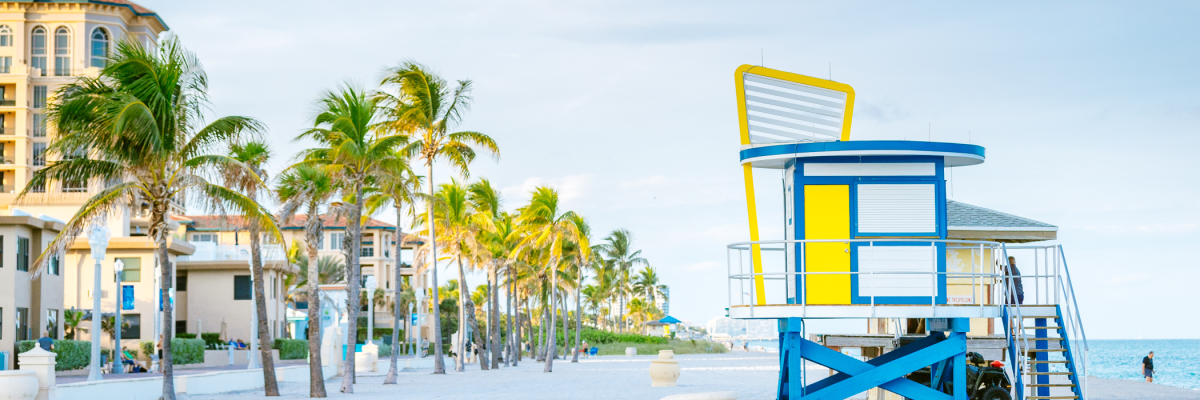 A brightly-colored lifeguard stand watches over the white sands of Hollywood Florida