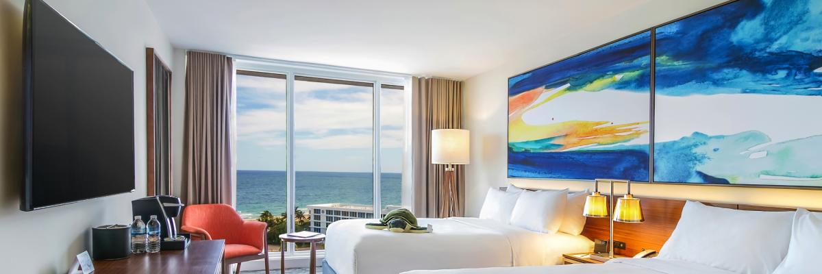 Interior of an oceanfront room with double beds at B Ocean hotel in Fort Lauderdale