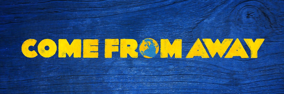 This image features the logo for "Come From Away," a Broadway musical, displayed in bright yellow text against a deep blue wooden-textured background. The logo includes a small globe or Earth image integrated into the letter "O" in "FROM." The design has a rustic, textured appearance that evokes both warmth and the show's maritime setting.