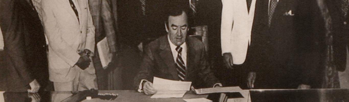 The late Gov. Hugh Carey signs the New York Farm Winery Act of 1976 in Albany.
