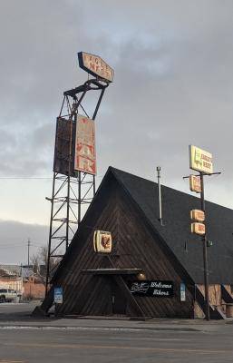 The sign for the Eagle's Nest Bar in Cheyenne, Wyoming, perched on a repurposed missile cradle
