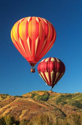 Two hot air balloons over Park City mountains during Autumn Aloft