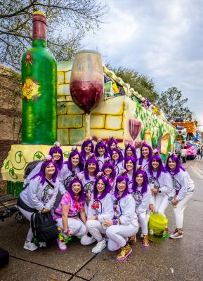 Members of the Krewe of Eve get ready to roll through the streets of Mandeville.