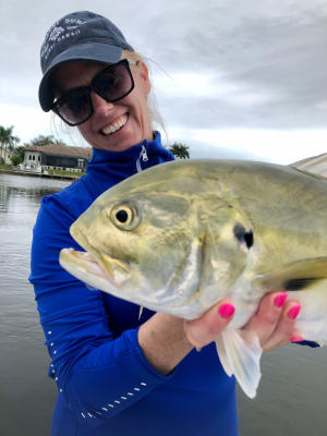 Fishing: Woman Holding a Crevalle Jack