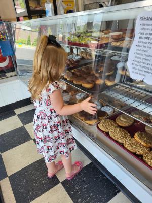 Girl picking out donut
