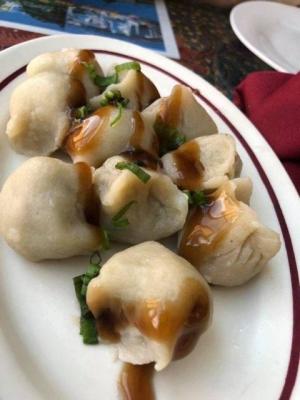Jennys Kuali serves house-made steamed dumplings drizzled in a rich sauce.