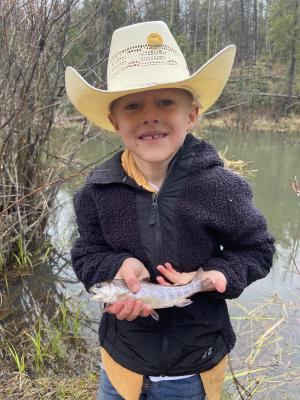 boy holding trout