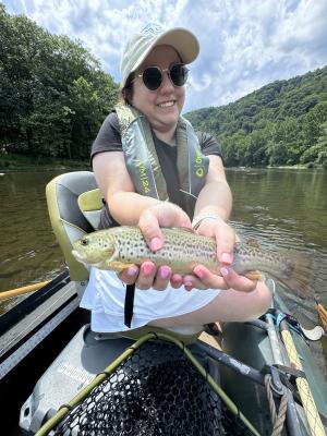 Maddie Wirebach, GO Laurel Highlands digital marketing coordinator, shows off a fish she pulled from the Youghiogheny River.