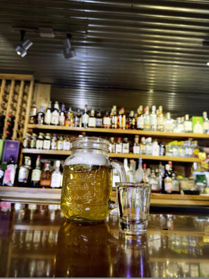 Cocktail served in mason jar at Los Caminos Bar.