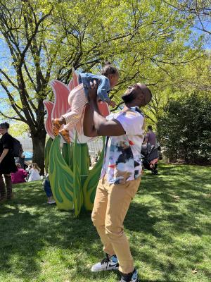 Father and daughter posing in front of flower photo prop at the Tulip Festival