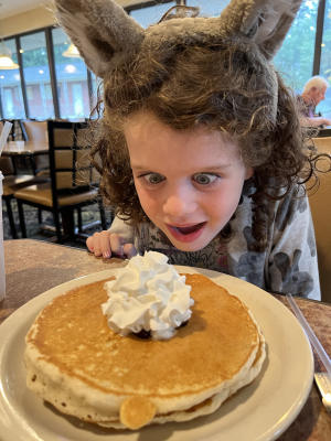 Little girl staring at pancake at Capitol Pancake House