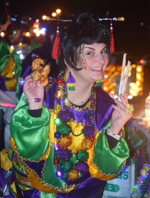 Brightly costumed rider in the Krewe of Titans parade