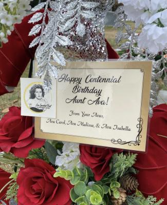 Close up of card on Ava Centennial floral arrangement