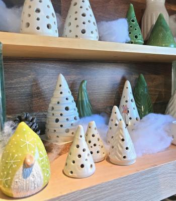 Yellow clay gnome and white tree-shaped votives