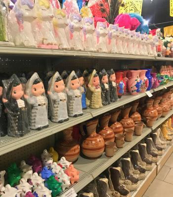 Shelves stocked with ceramic piggy banks