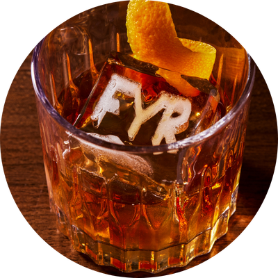Alcoholic drink with "FYR" ice cube