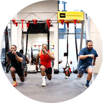 Three men doing a TRX workout
