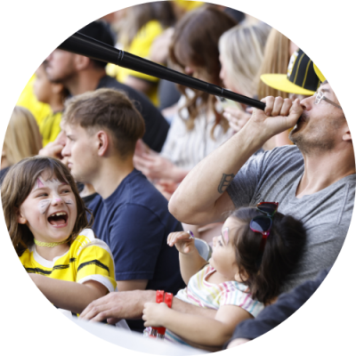 Father and two children cheering on the Columbus Crew