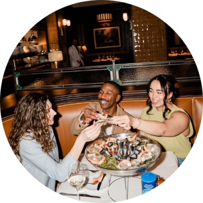 Three friends enjoying oysters