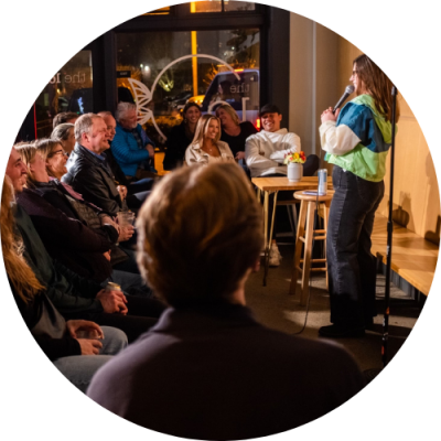 Comedian doing stand-up performance for crowd