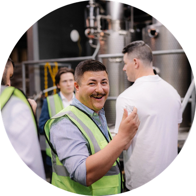 Man smiling and laughing during distillery tour