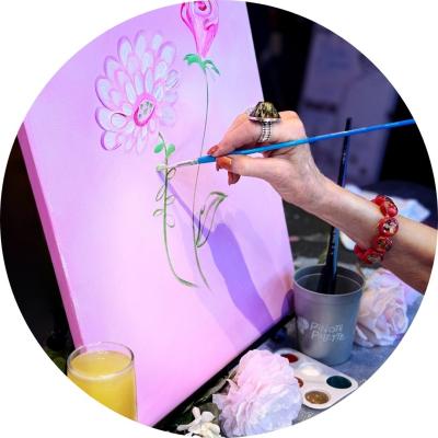 Canvas with flowers being painted on it