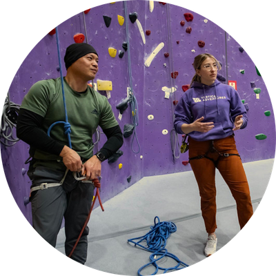 Man preparing to climb indoor rock wall