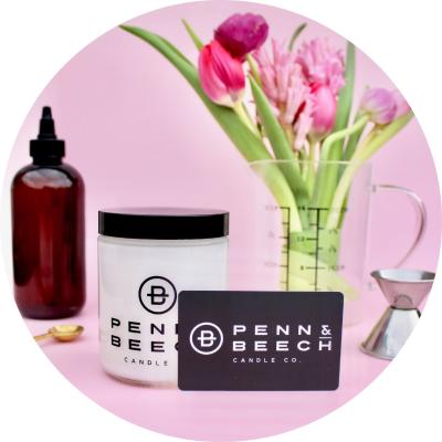 Penn & Beech gift card, candle vessel, tools, and flowers set on pink background