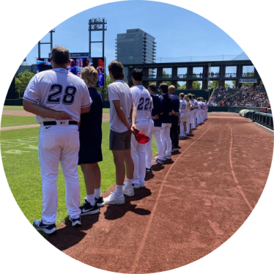 Columbus Clippers team lined up on baseball field during National Anthem