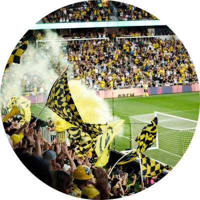 Fans cheering in stands during Columbus Crew game
