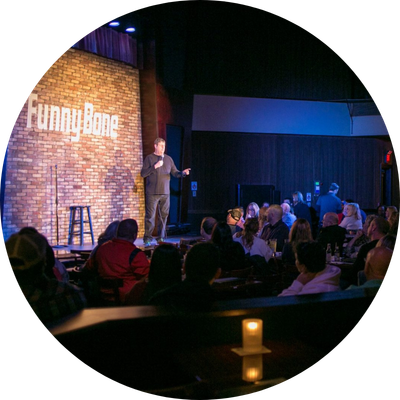Man doing comedy on stage