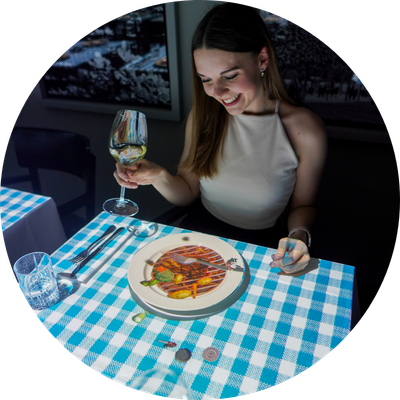 Woman enjoying Le Petit Chef experience
