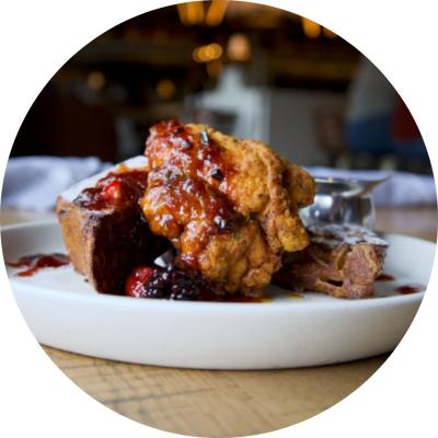 French toast with Cinnamon Swirl Bread, Fried Chicken, Mixed Berry Compote, and Maple Syrup