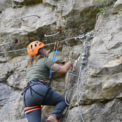 Woman climbing via ferrata at Quarry Trails Metro Park