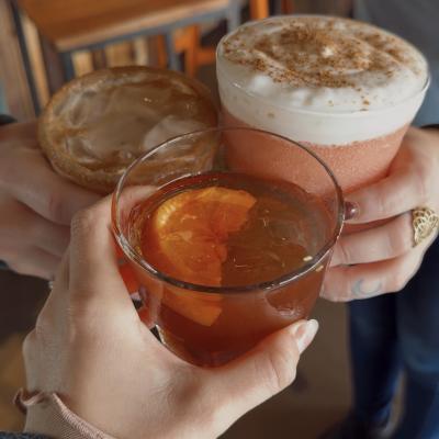 Three different seasonal fall drinks clinking at Station on Kings.