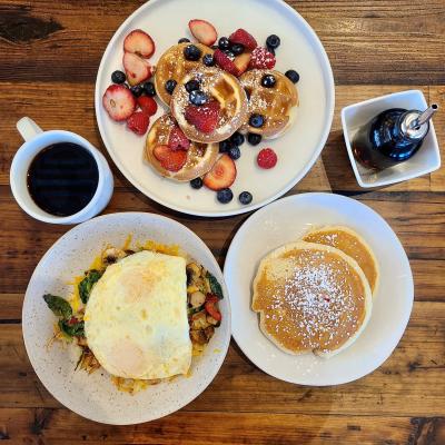 Gluten free pancakes, waffles, and fried egg platter.