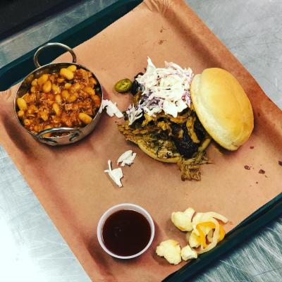 A BBQ sandwich and side on a platter at Stella Blue BBQ