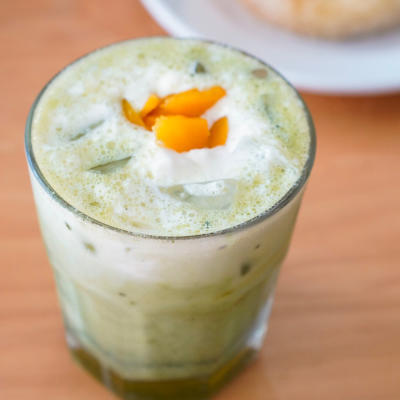 iced peach matcha drink