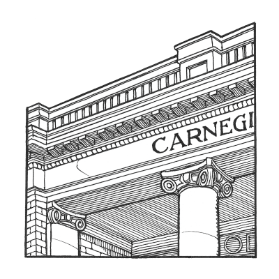 The Carnegie Library’s stylized capital sits atop its columns before its recessed portico entryway.