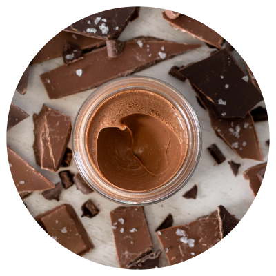 Belgian chocolate dessert pot with pieces of chocolate surrounding