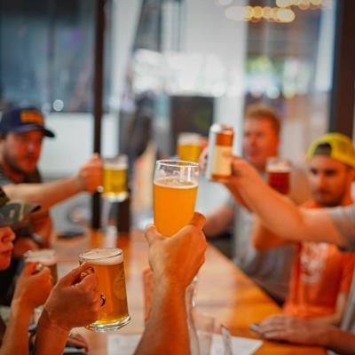 Group of men raising their glasses in a toast