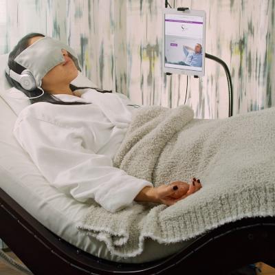 Woman relaxing with sound waves in a Spa